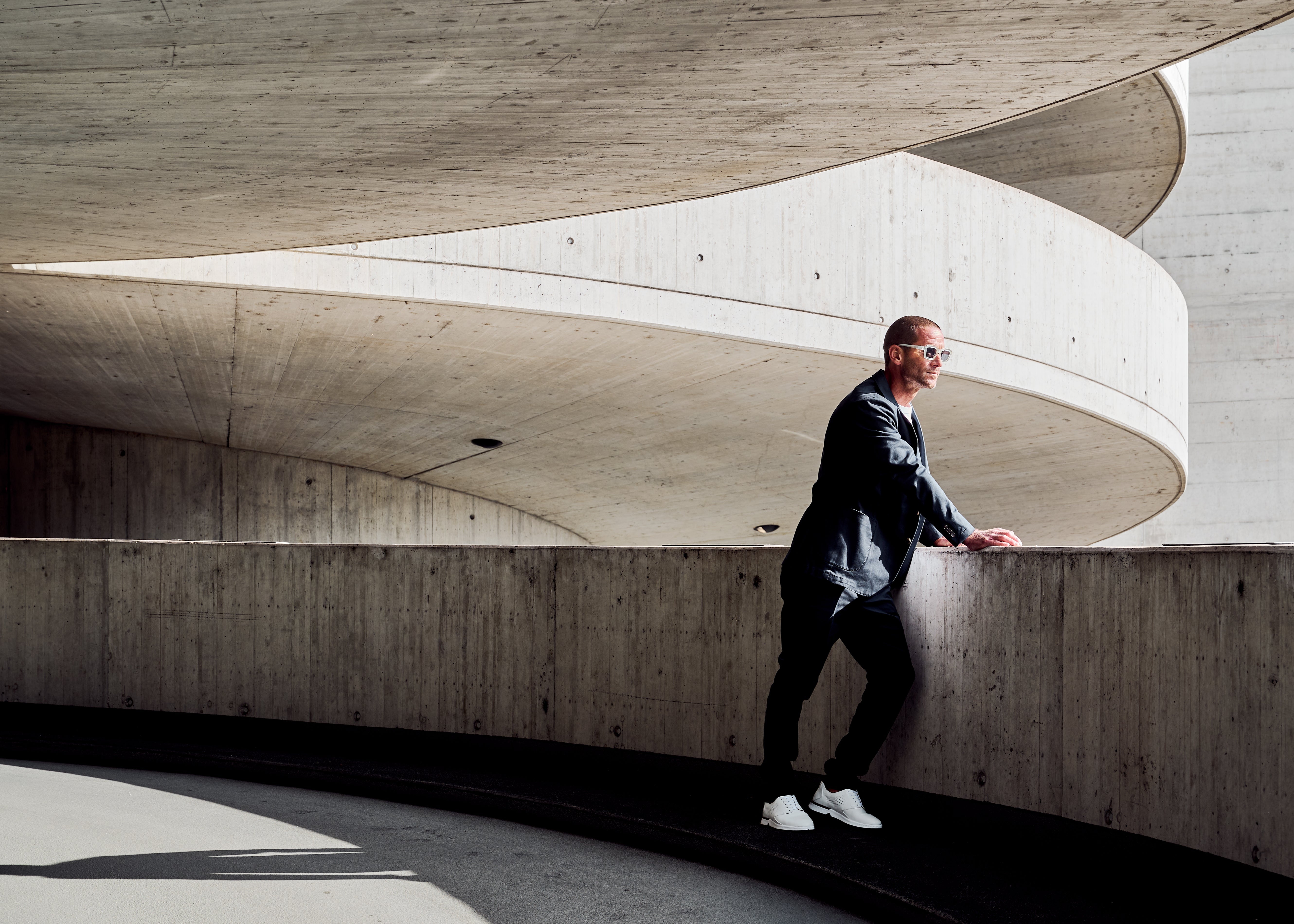 Model wearing white RONIN looking into the distance. KANREY derby shoes in white.