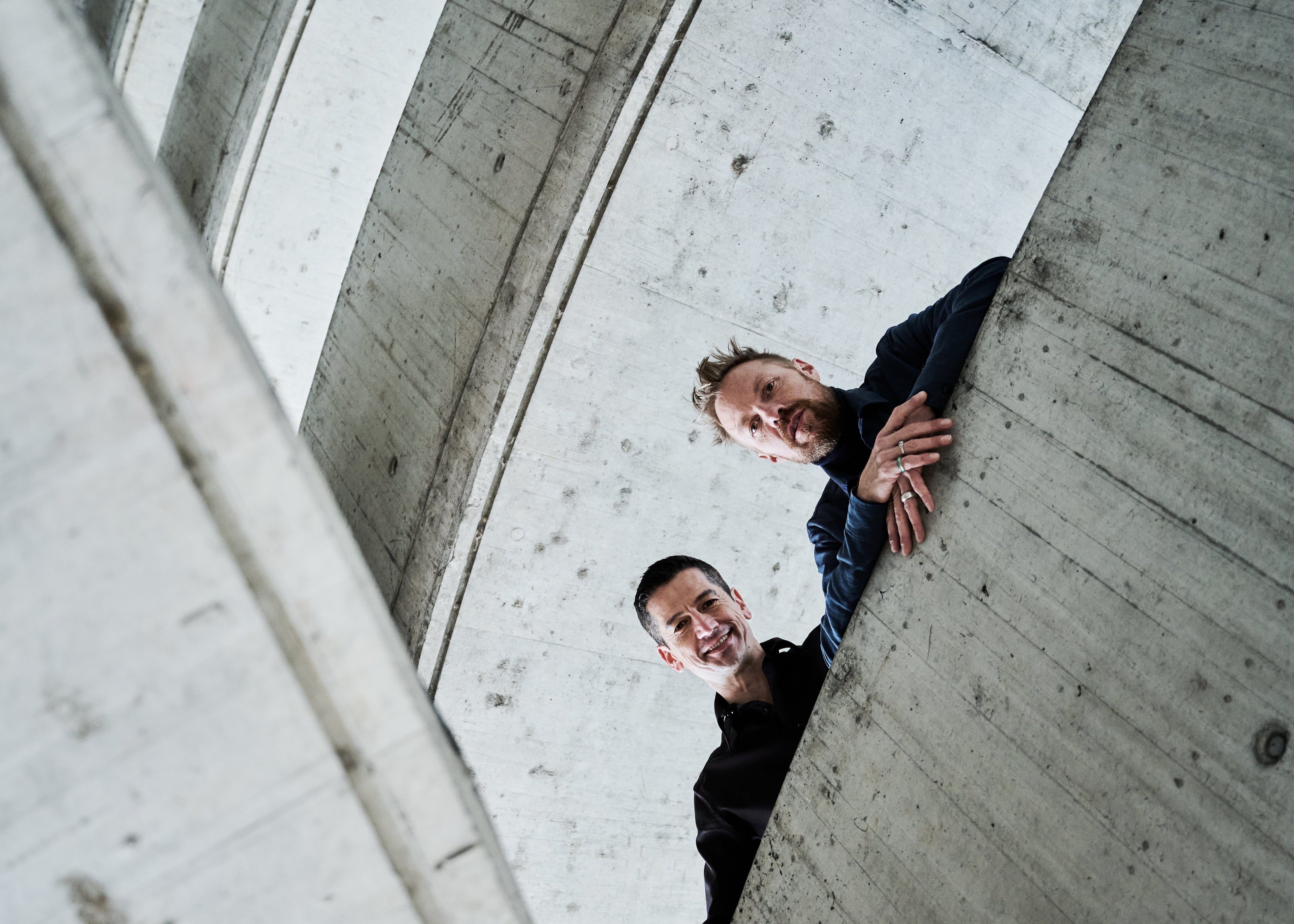 Low-angle shot of KANREY founders. KANREY fashion shoes.