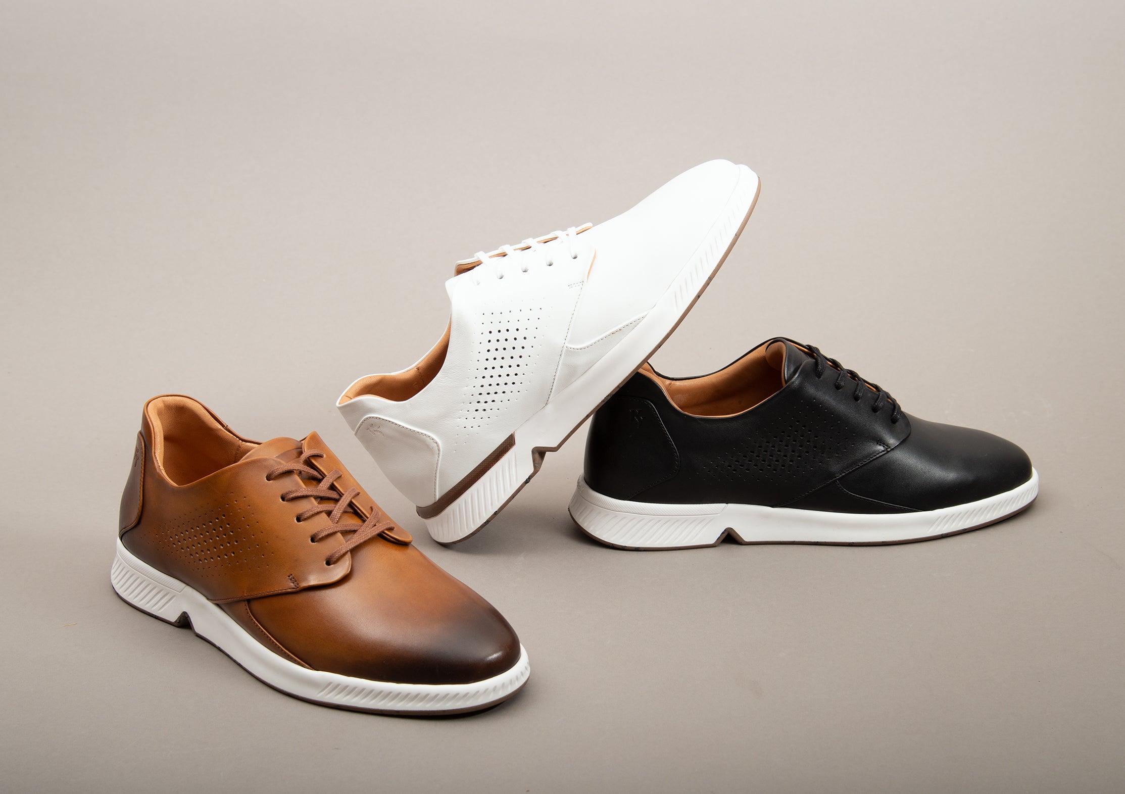 The Model RONIN in the colors tan, black, and white