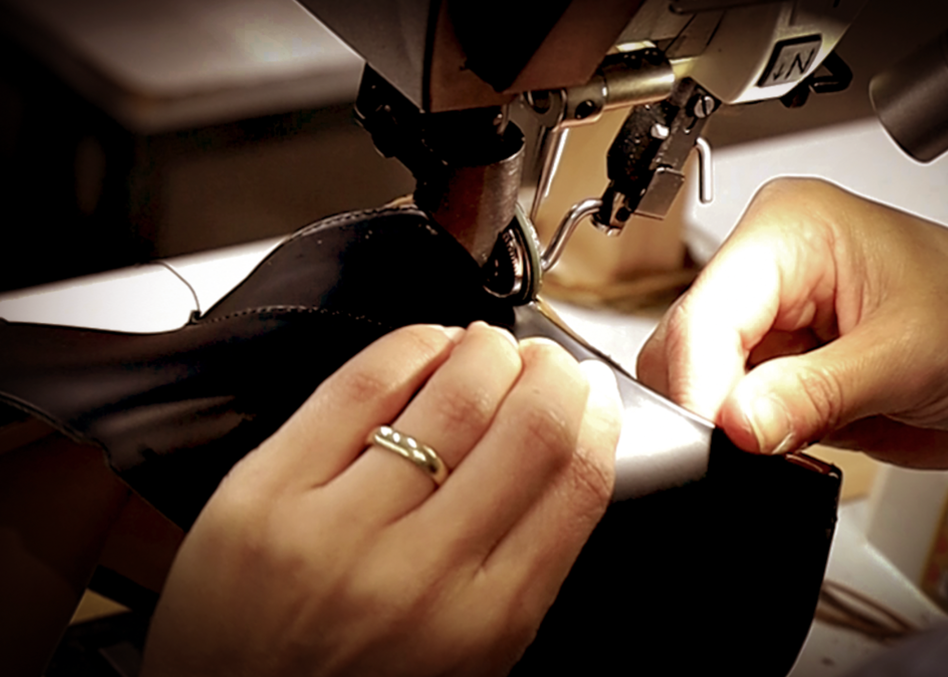 Woman stitching an upper. KANREY fashion shoes